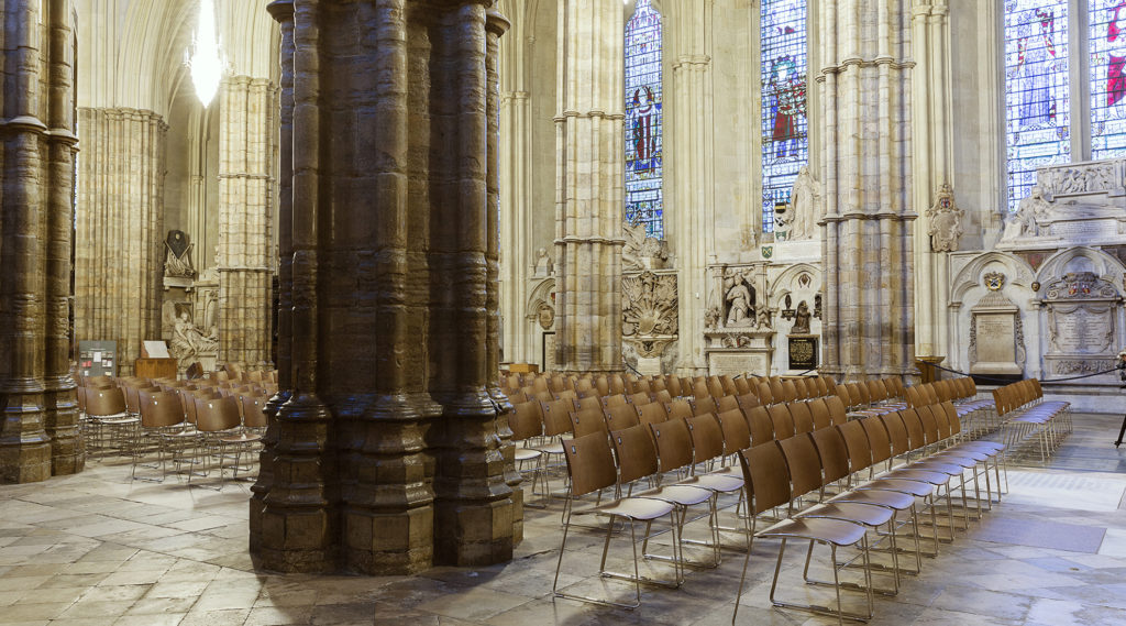 Church furniture Casala | Wooden Curvy church chairs with Zifra digital chair numbering at Westminster Abbey in London